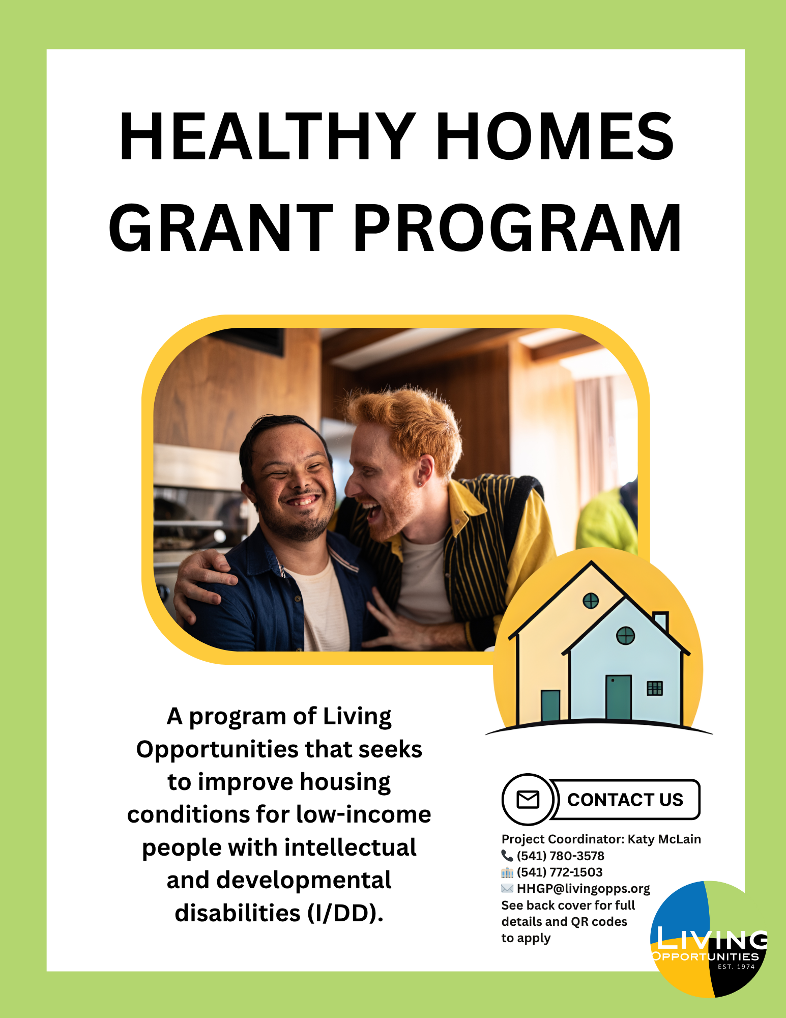 Two men are sitting together smiling.