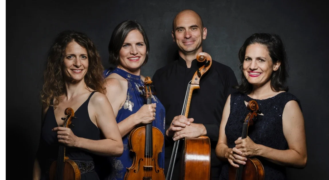 The Jupiter String Quartet holding their violins, viola and cello